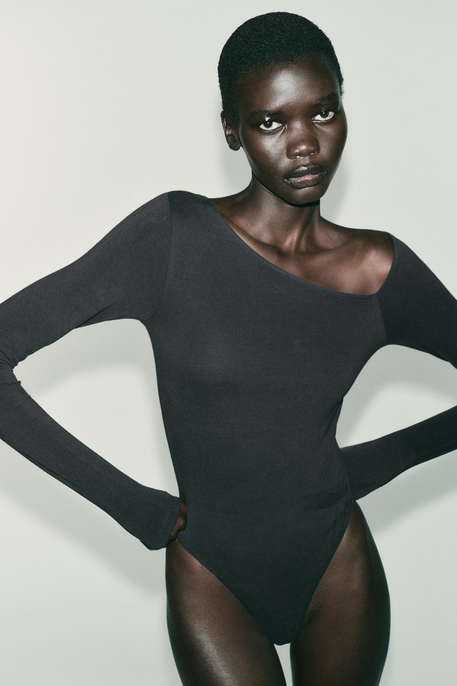 ASYMMETRIC LONG SLEEVE BODYSUIT