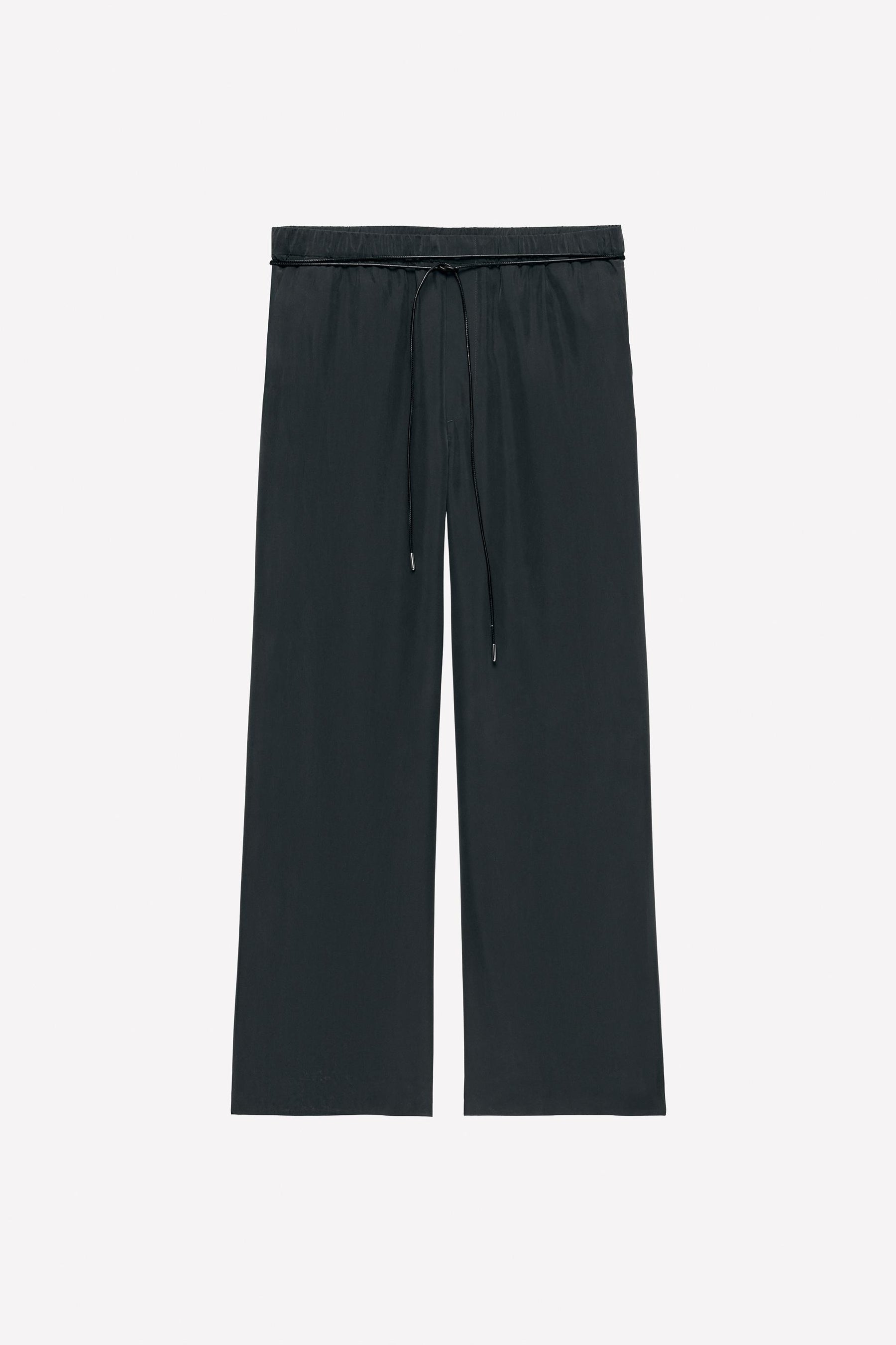 Silk trousers with belt.