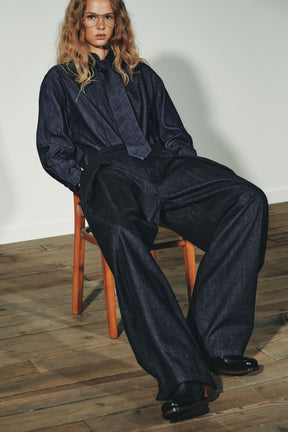 PLEATED DENIM TROUSERS