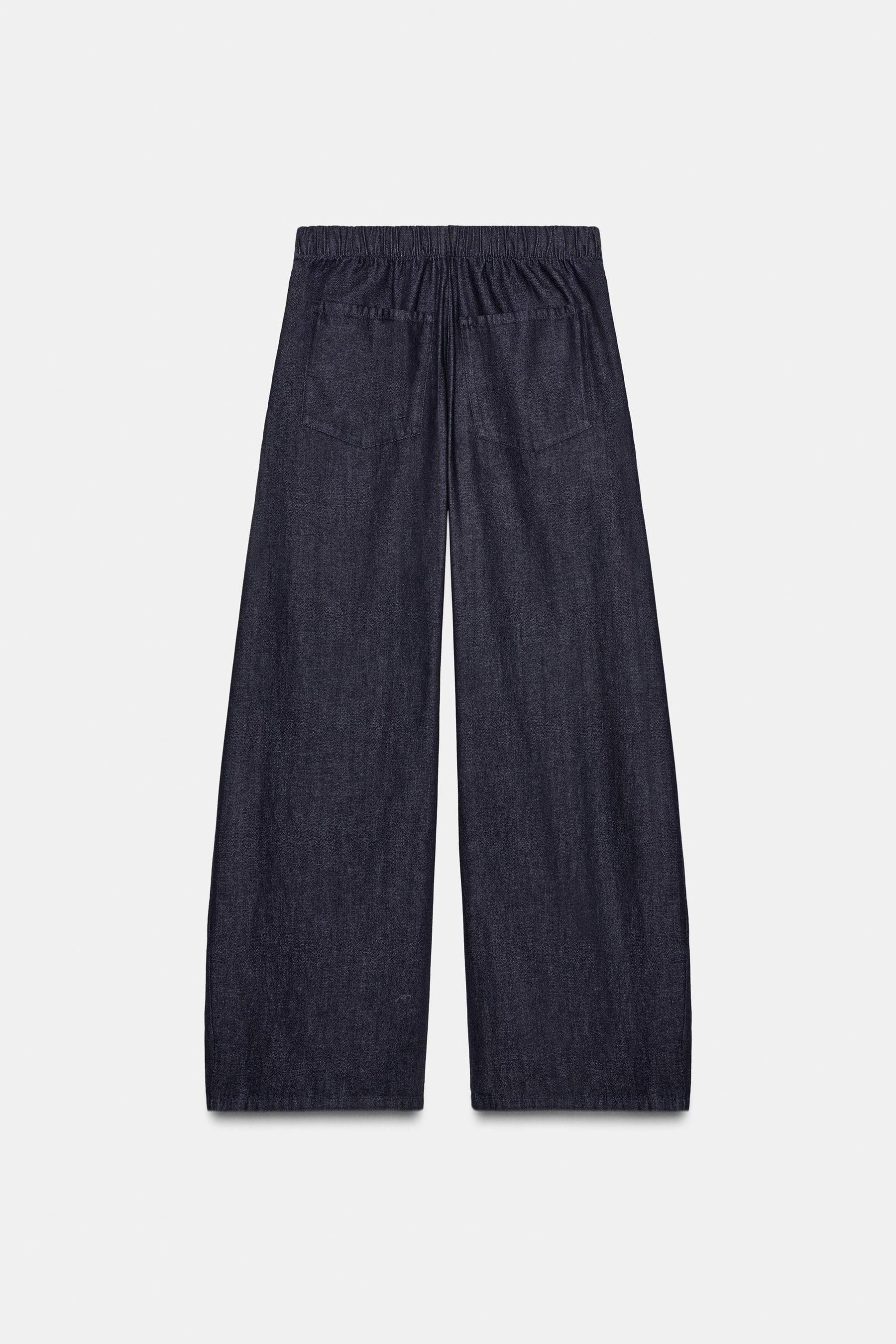 PLEATED DENIM TROUSERS