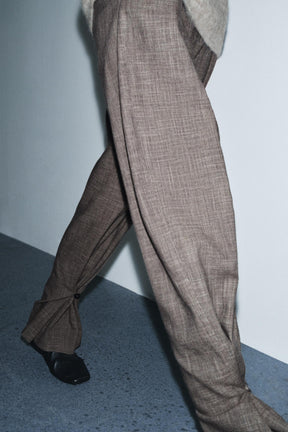 Trousers with button cuff